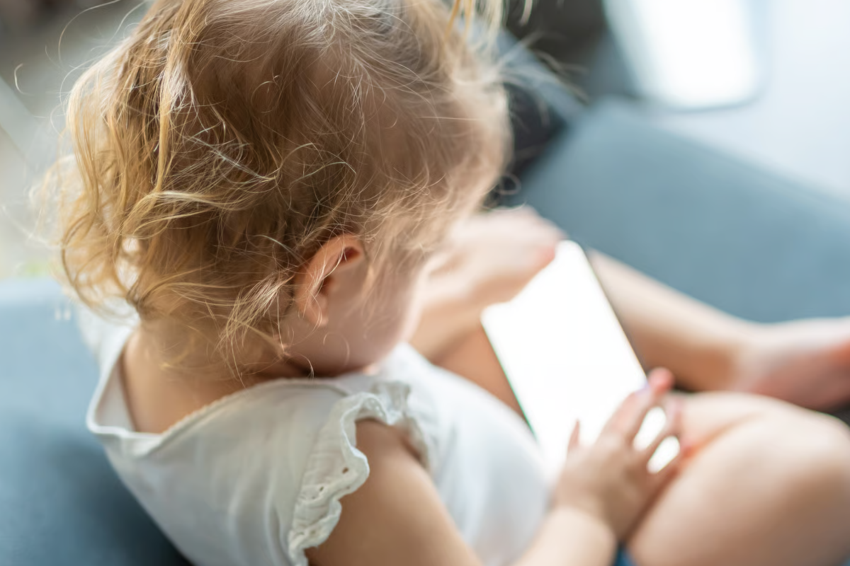 Child looing at phone screen